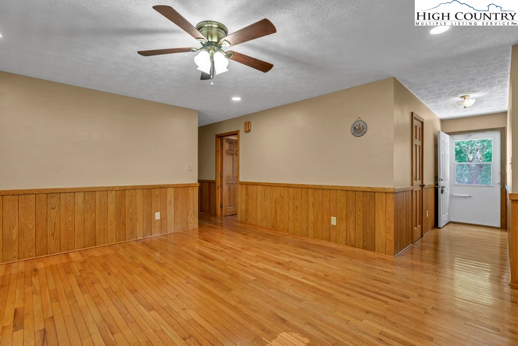 450 Astor Cook Road Blowing Rock, NC 28605 - Photo 4 of 39 wooden floor in an empty room with a window