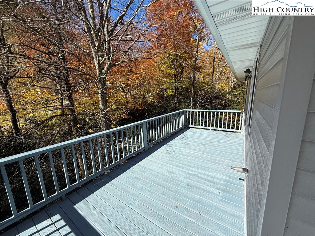 450 Astor Cook Road Blowing Rock, NC 28605 - Photo 10 of 39 a balcony with wooden floor and fence