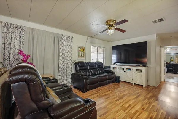 a view of a dining room with furniture window and wooden floor