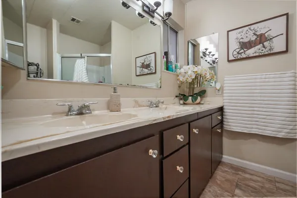 a bedroom with bed and wooden floor