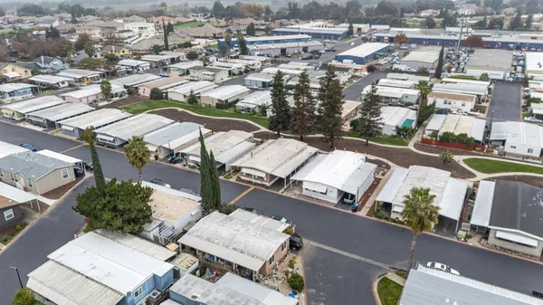 an aerial view of residential houses with outdoor space