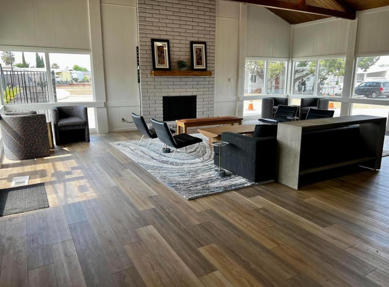 2845 East Hatch Road, Unit 84 Ceres, CA 95351 - Photo 37 of 39 a living room with furniture windows and a fireplace