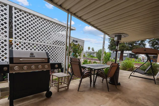 a kitchen with stainless steel appliances a sink stove refrigerator and cabinets