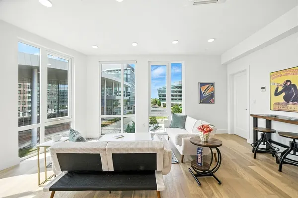 a living room with furniture and a large window