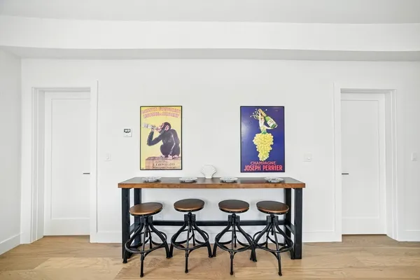 a view of a dinning room with furniture and wooden floor
