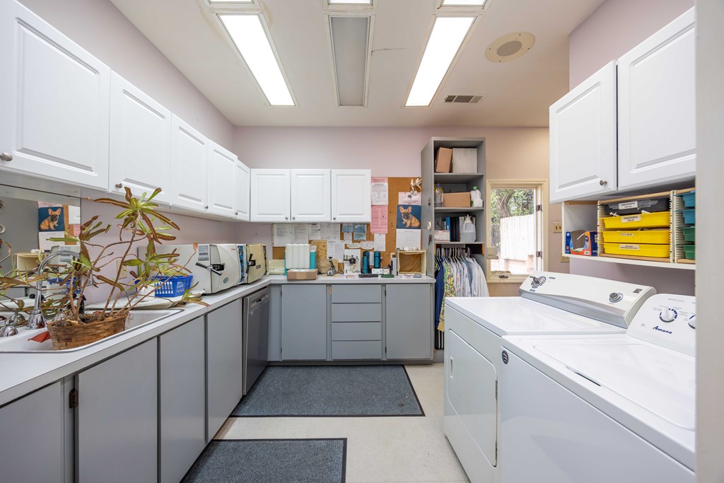 3612 Edgewood Road Columbus, GA 31907 - Photo 16 of 29 a kitchen that has a lot of cabinets in it and wooden floors
