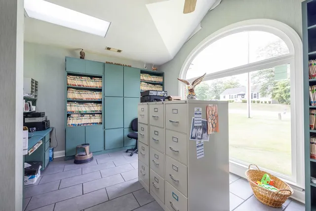 a kitchen with stainless steel appliances a refrigerator and a window