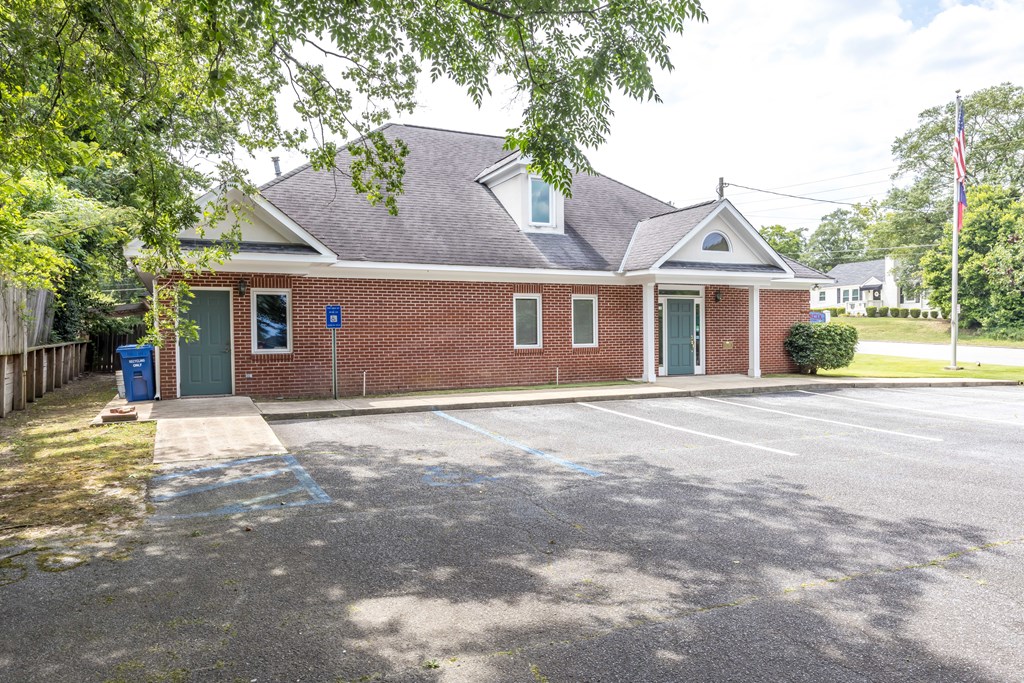 3612 Edgewood Road Columbus, GA 31907 - Photo 5 of 29 a front view of a house with a garden and yard