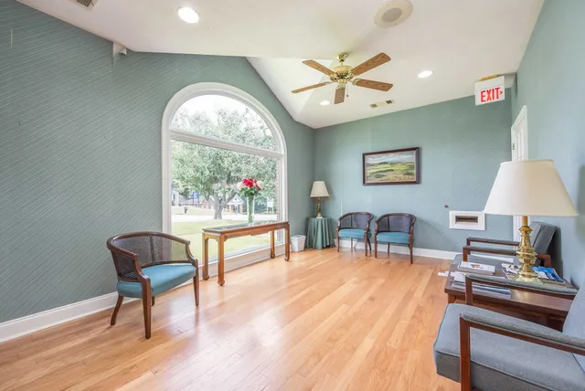 a view of a livingroom with furniture and a window