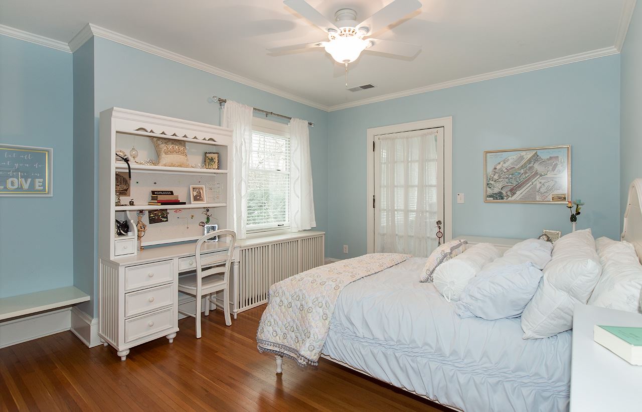 3 Jacoby Place Rockford, IL 61107 - Photo 15 of 25 a bedroom with a bed and a chandelier