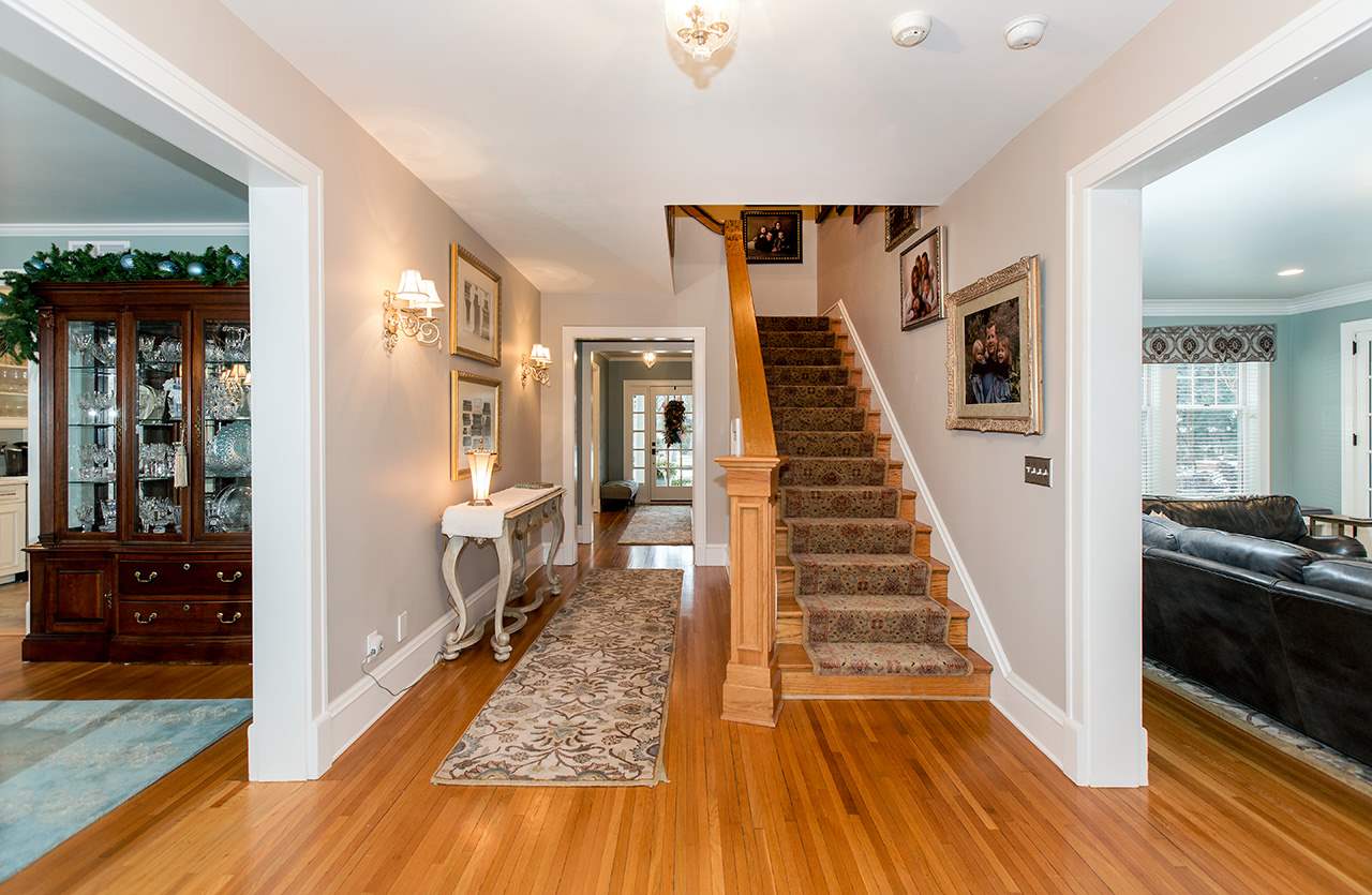 3 Jacoby Place Rockford, IL 61107 - Photo 4 of 25 a view of a hallway view with wooden floor and staircase