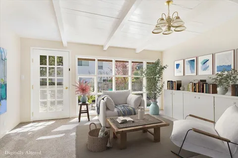 a living room with furniture and a table