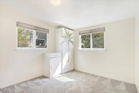 wooden floor in a room next to a window