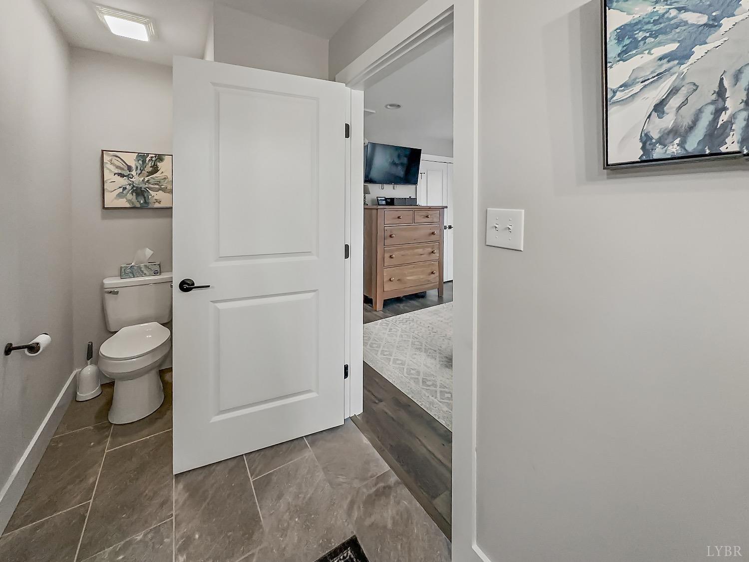 875 Lynbrook Road Rustburg, VA 24588 - Photo 19 of 27 a bathroom with a granite countertop sink and a toilet