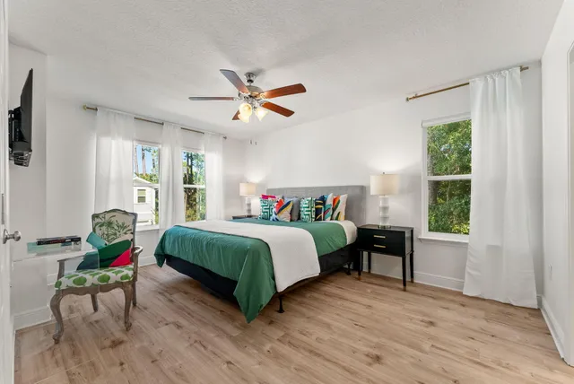 a bedroom with a bed and a table