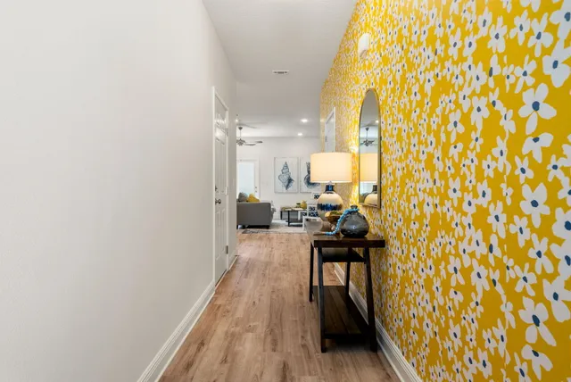 a view of a living room and bathroom
