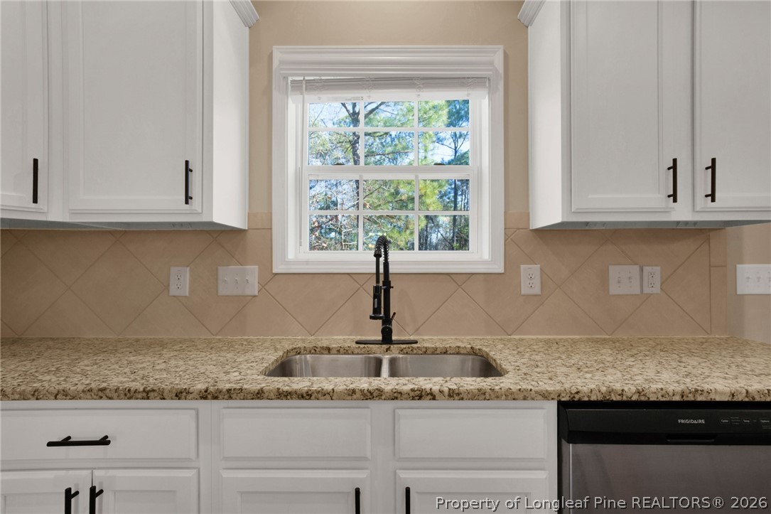 448 Pittfield Run Cameron, NC 28326 - Photo 16 of 43 a kitchen with granite countertop a sink and a window