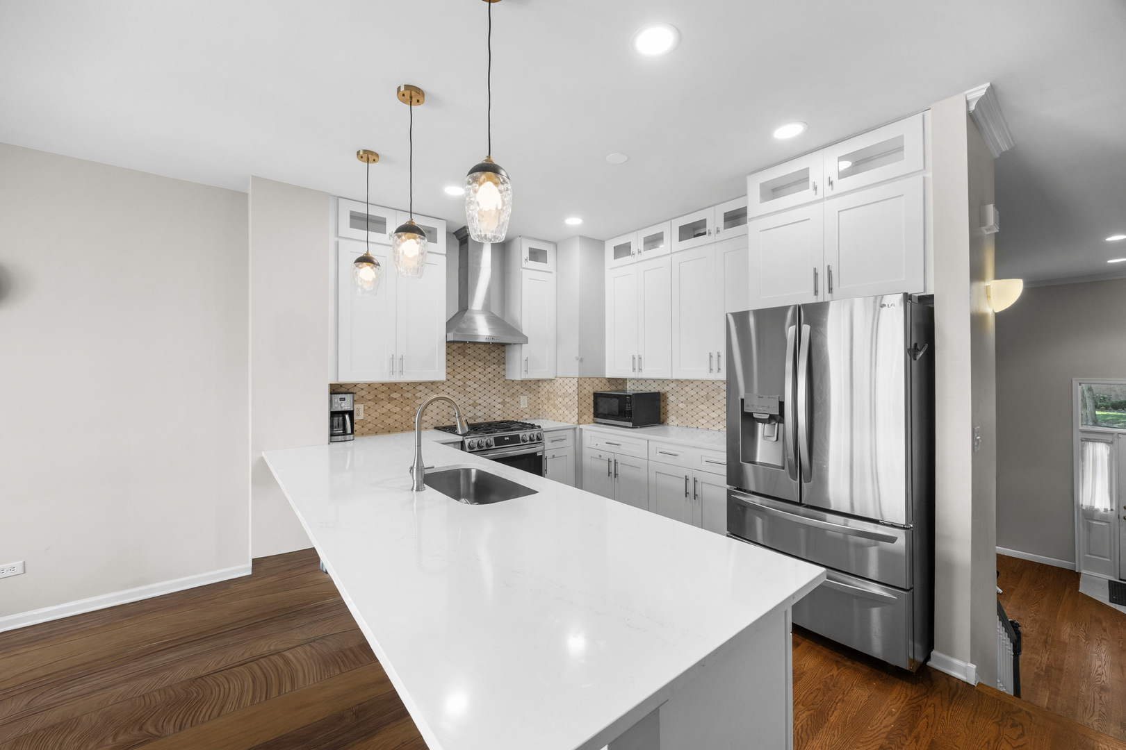 5230 South University Avenue, Unit D Chicago, IL 60615 - Photo 6 of 18 a kitchen with a refrigerator a sink and wooden floor