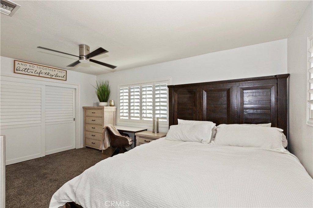 1705 Jeryl Avenue Colton, CA 92324 - Photo 12 of 24 a bedroom with a bed and a window