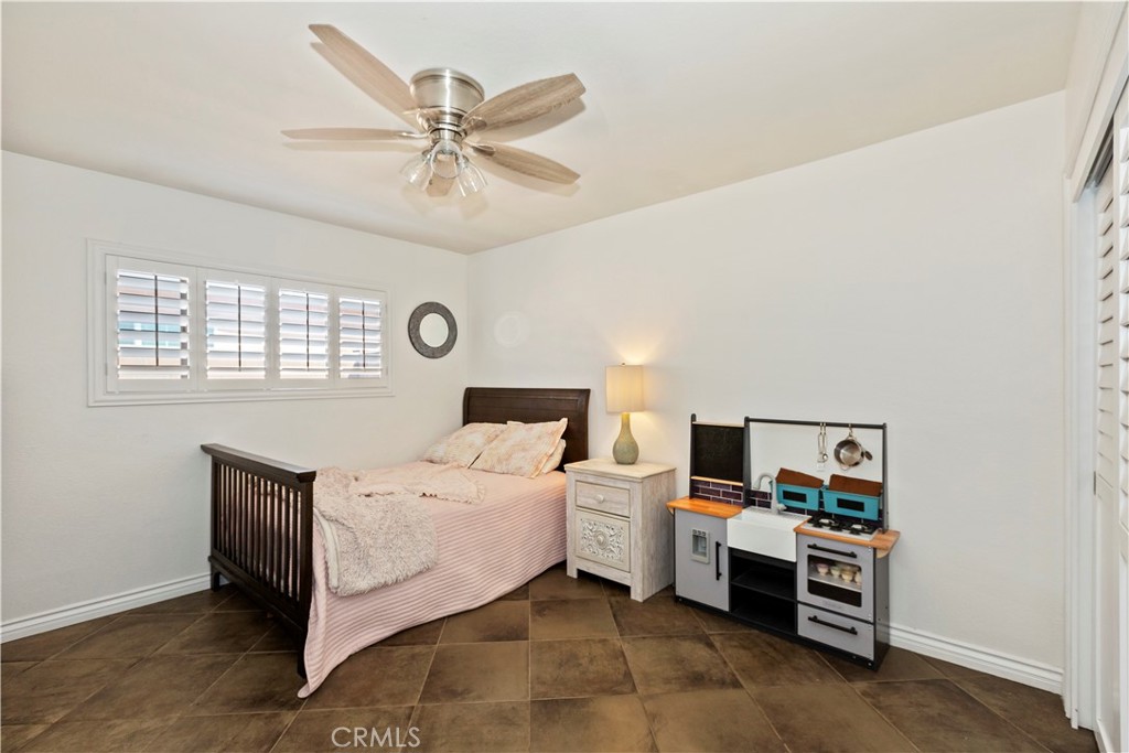 1705 Jeryl Avenue Colton, CA 92324 - Photo 14 of 24 a room with a bed and a window