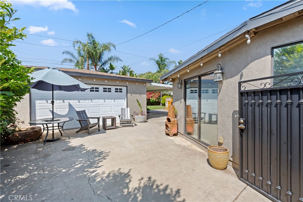 1705 Jeryl Avenue Colton, CA 92324 - Photo 19 of 24 a view of a chairs and table in backyard