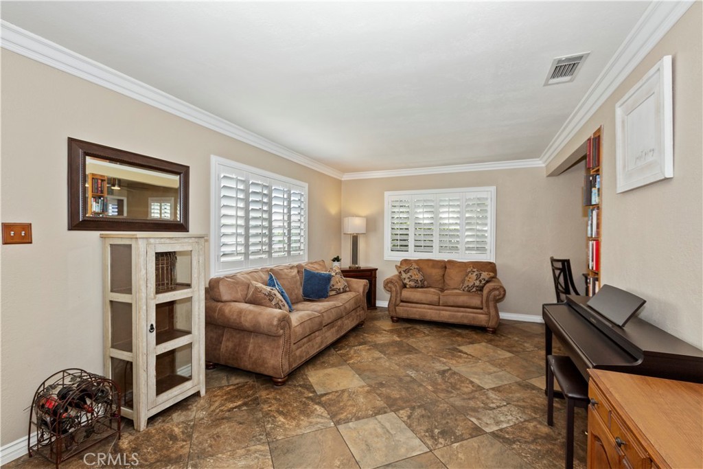 1705 Jeryl Avenue Colton, CA 92324 - Photo 2 of 24 a living room with furniture and a window