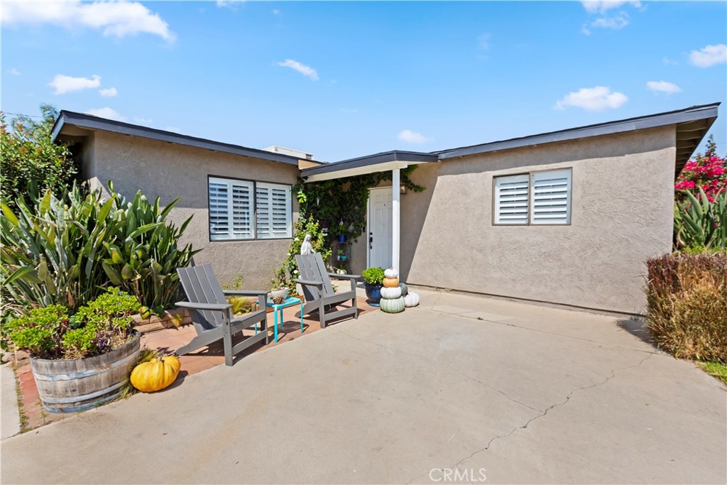 1705 Jeryl Avenue Colton, CA 92324 - Photo 23 of 24 a view of a patio with table and chairs and potted plants