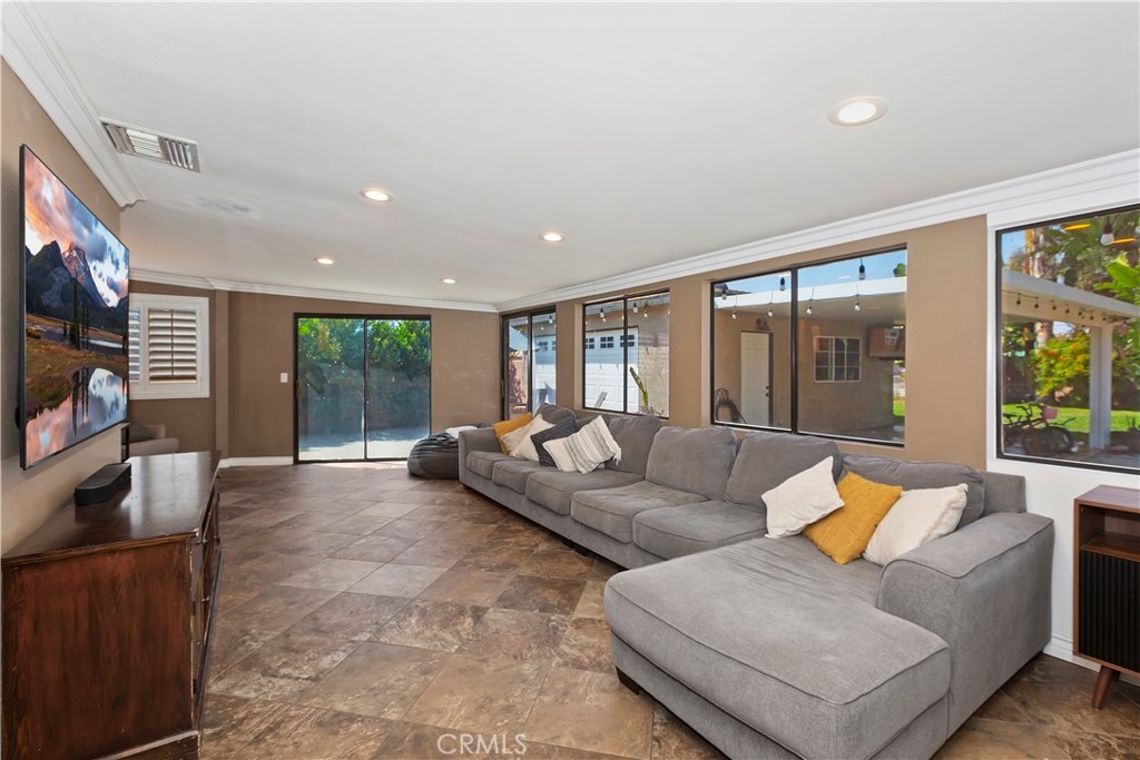 1705 Jeryl Avenue Colton, CA 92324 - Photo 5 of 24 a living room with furniture and a flat screen tv