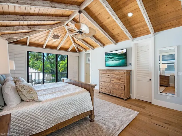 a spacious bathroom with double vanity and a mirror