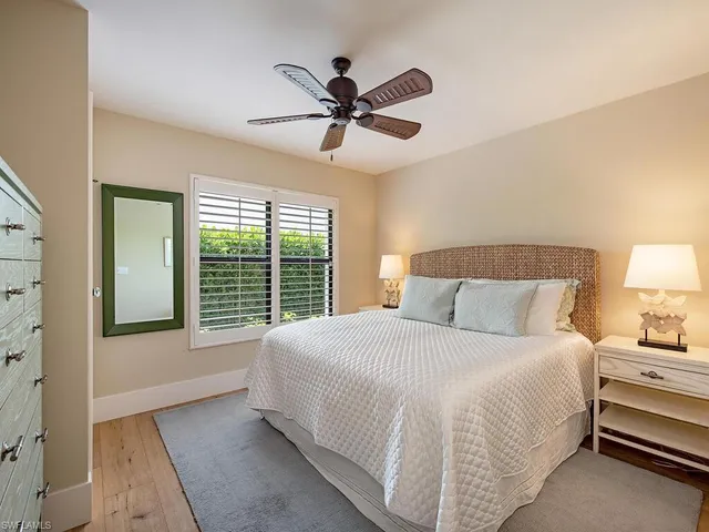 a bathroom with a granite countertop sink toilet a mirror and shower