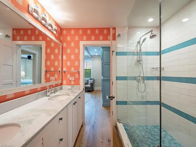 a spacious bedroom with a large bed and a large window