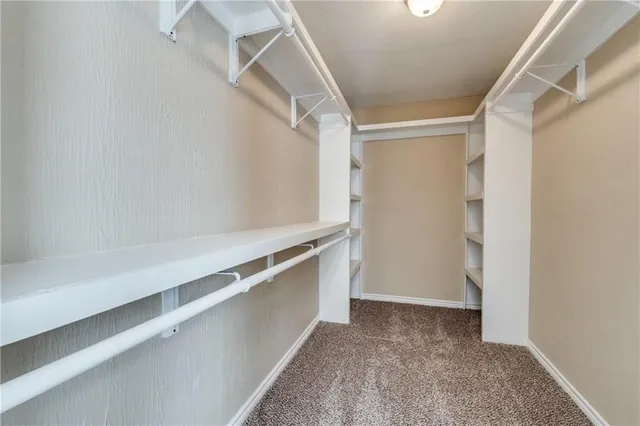 a view of an empty walk in closet