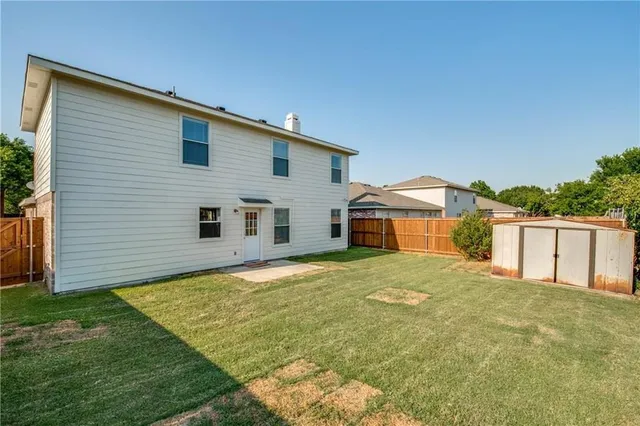 a house view with a backyard space