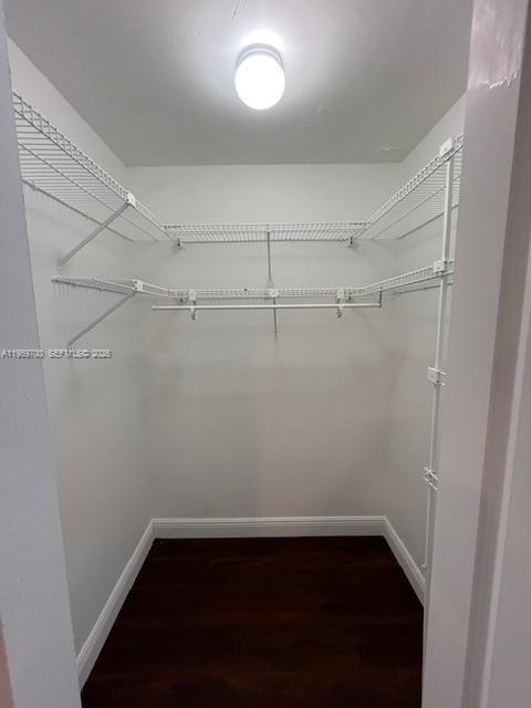18336 Northwest 68th Avenue, Unit E Hialeah, FL 33015 - Photo 6 of 9 a view of a room with racks on the wall