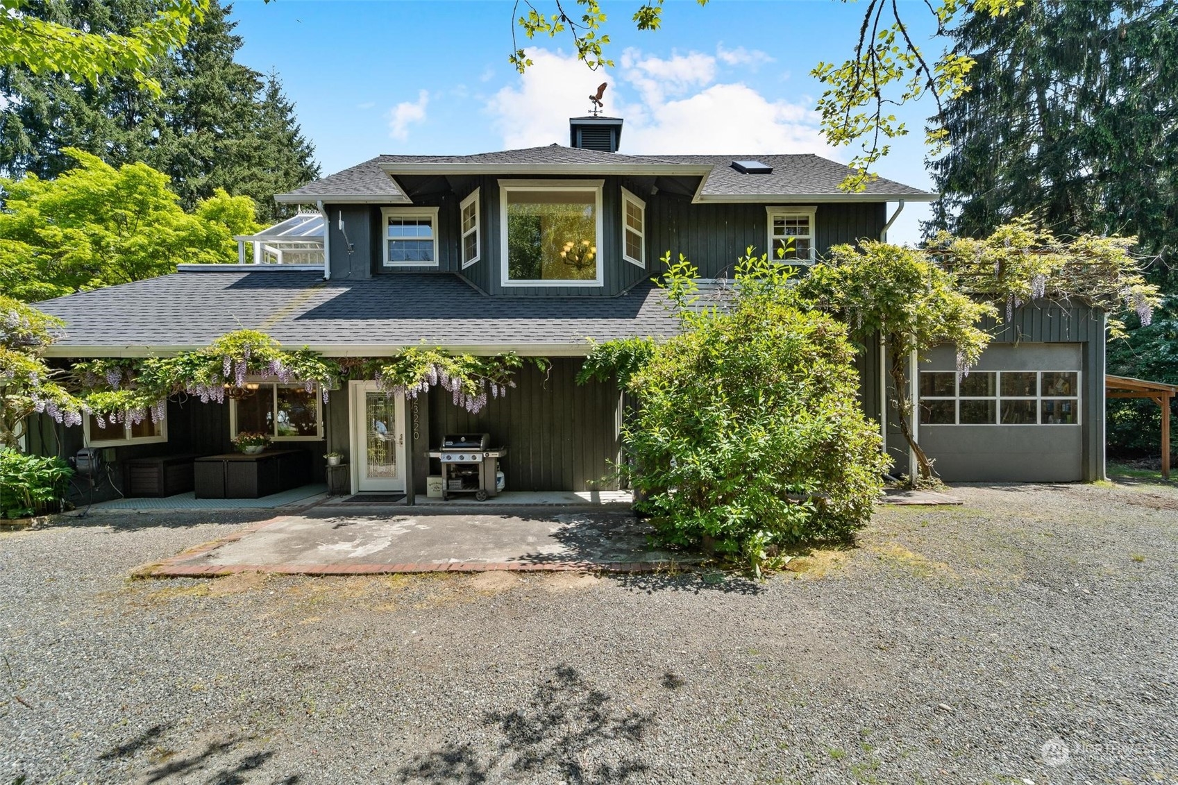 a front view of a house with garden