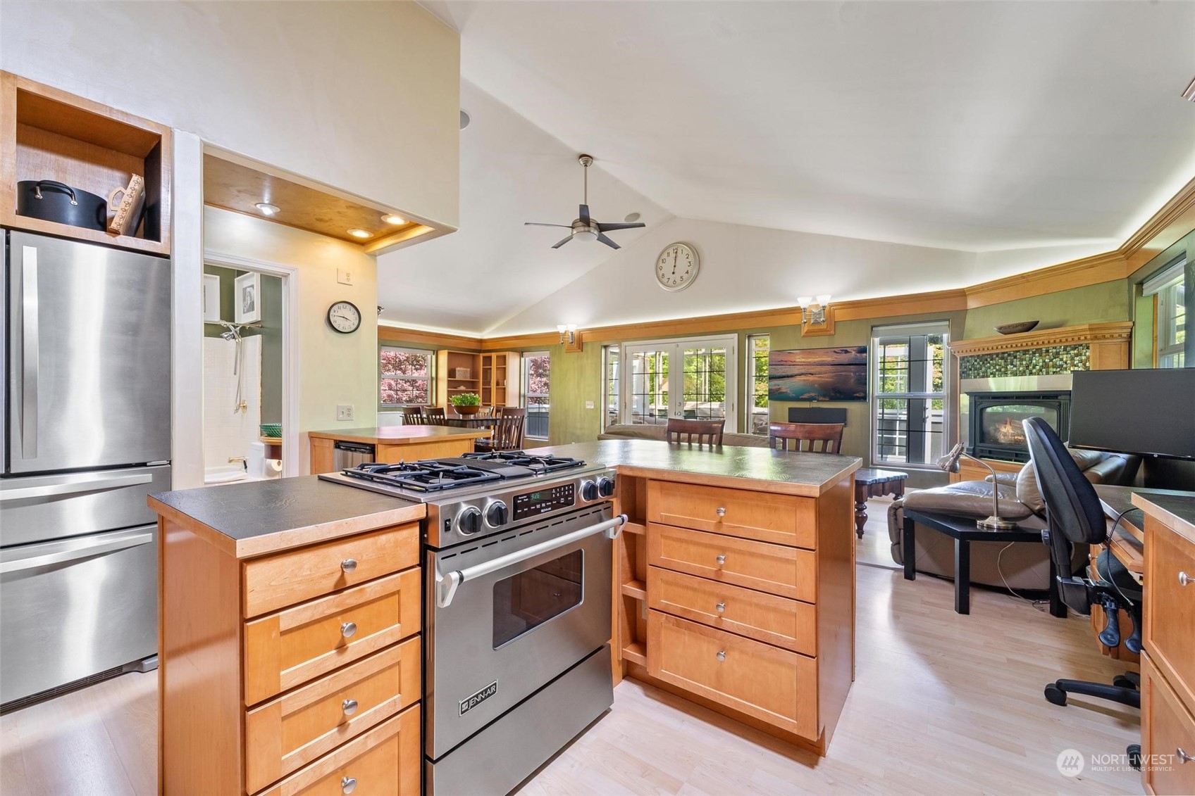 23220 49th Avenue Southeast Bothell, WA 98021 - Photo 17 of 40 a kitchen with stainless steel appliances granite countertop a stove and a refrigerator