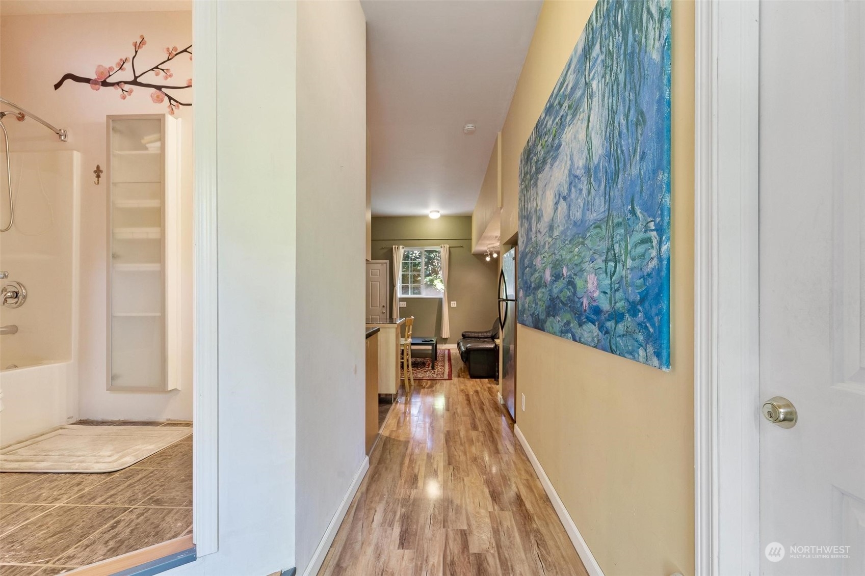 23220 49th Avenue Southeast Bothell, WA 98021 - Photo 29 of 40 a view of a hallway with wooden floor and a living room
