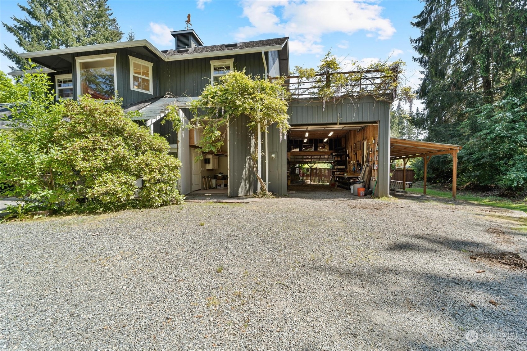 23220 49th Avenue Southeast Bothell, WA 98021 - Photo 38 of 40 a front view of a house with a yard and garage