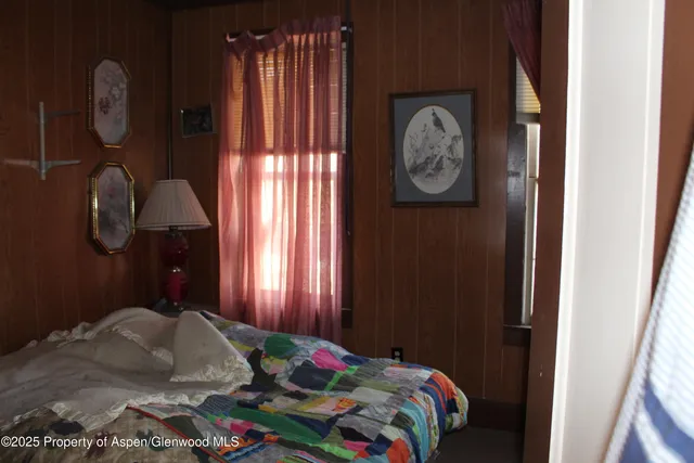 a bedroom with a bed and a closet in it