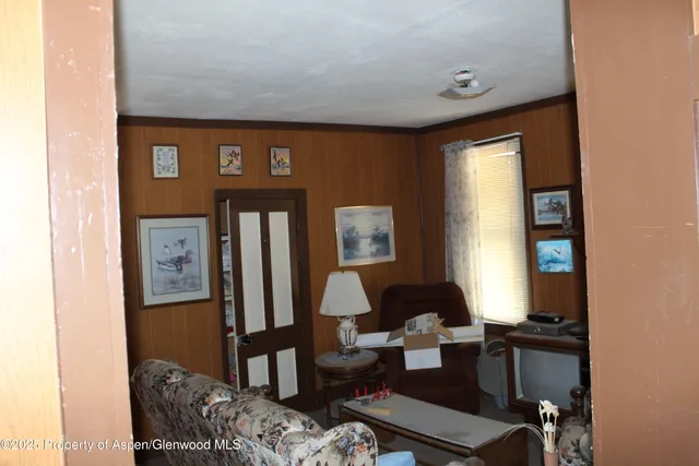 a living room with furniture and window