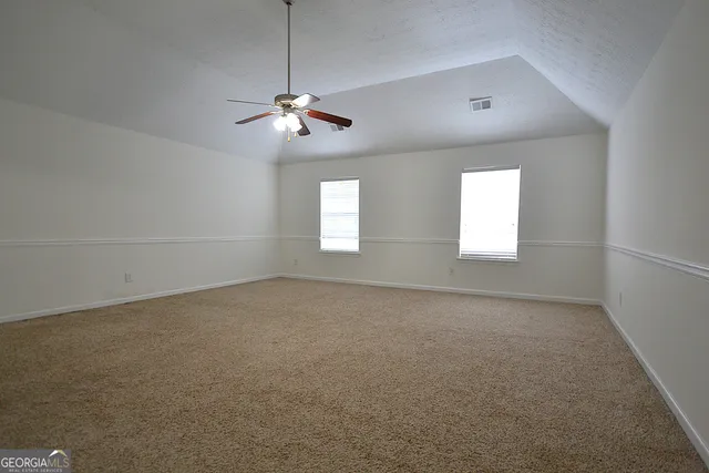 a view of empty room with windows