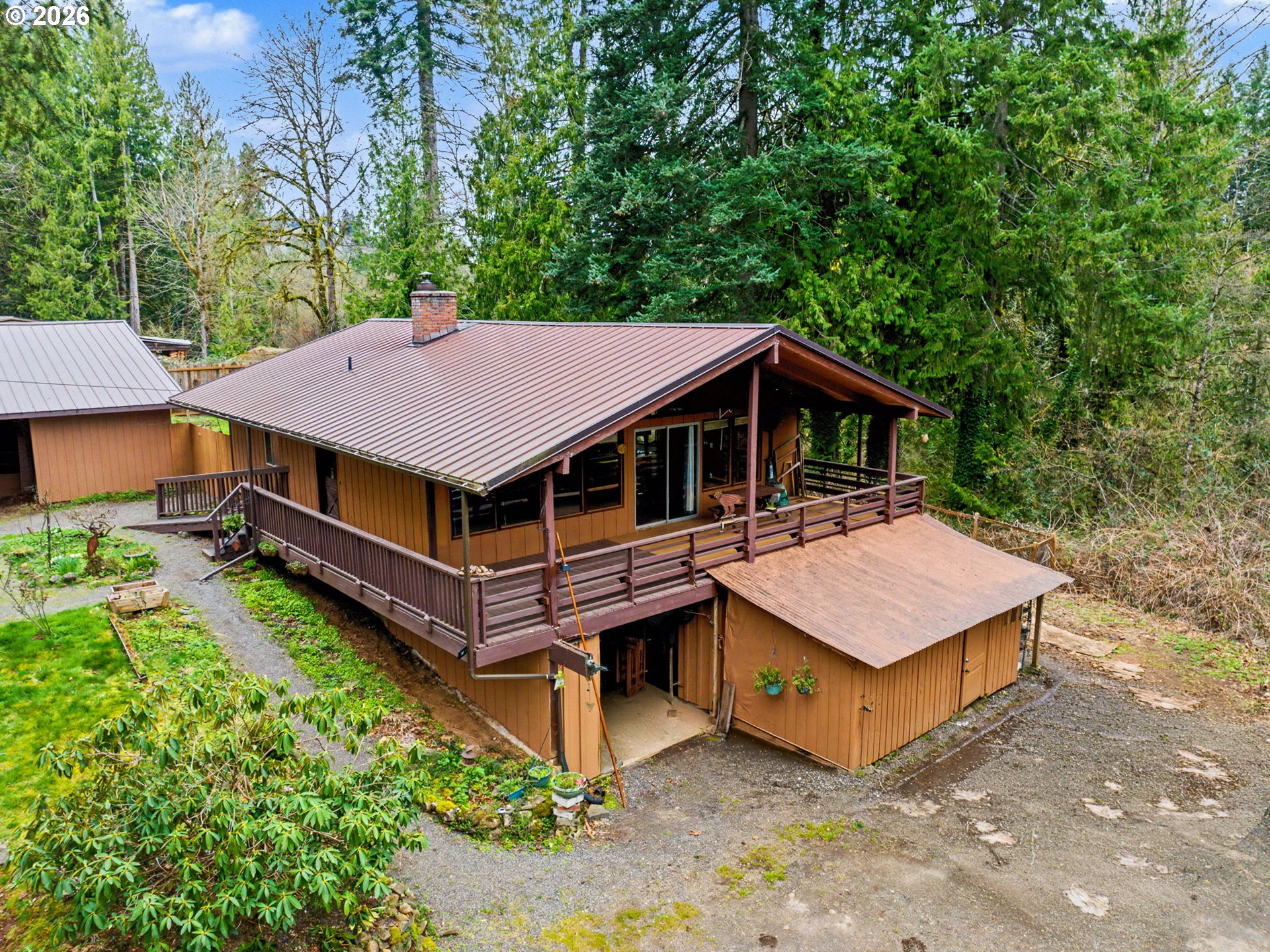 an aerial view of a house with roof deck front of house