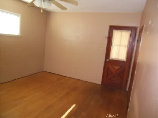 an empty room with a mirror