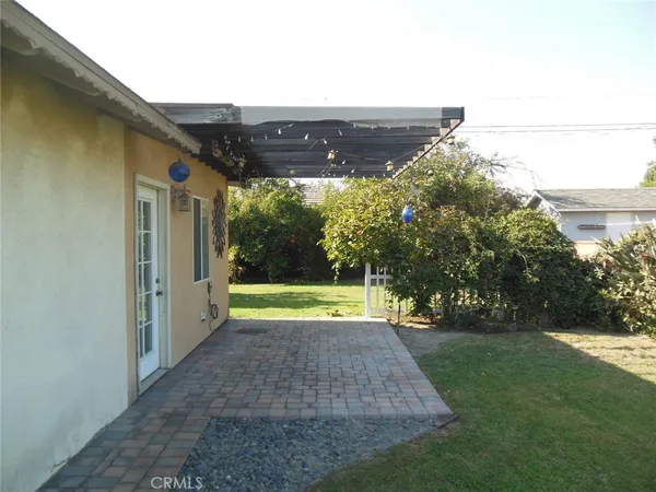a view of swimming pool with an outdoor seating