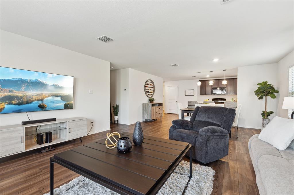 425 Sweetshade Lane Princeton, TX 75407 - Photo 18 of 29 a living room with furniture and a flat screen tv