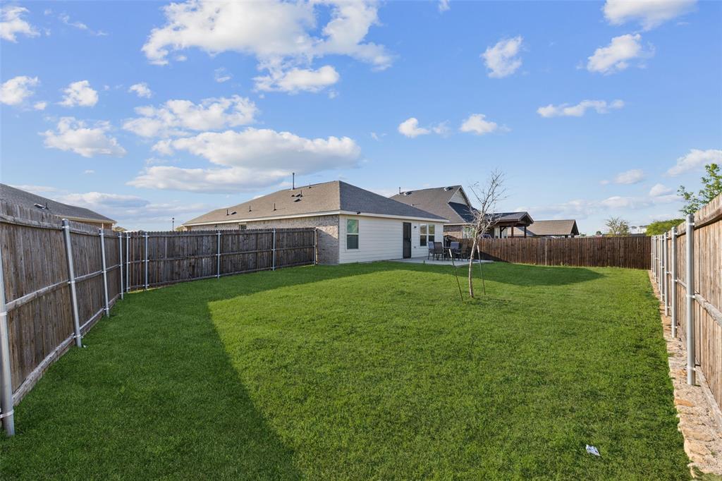 425 Sweetshade Lane Princeton, TX 75407 - Photo 23 of 29 a view of a house with backyard and porch