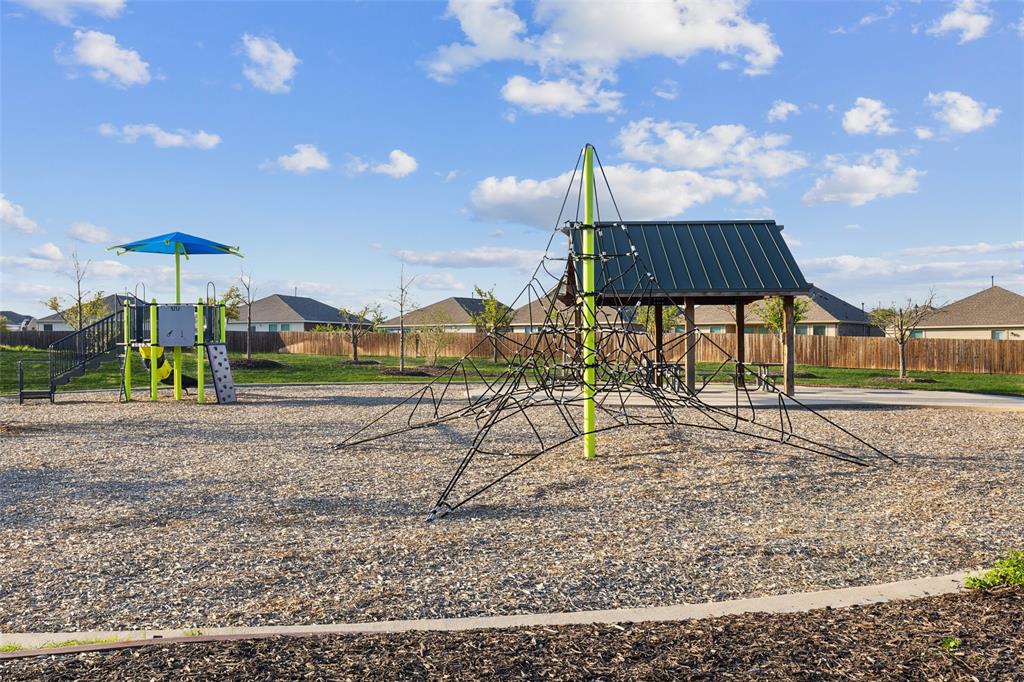 425 Sweetshade Lane Princeton, TX 75407 - Photo 28 of 29 a view of a yard with a slide