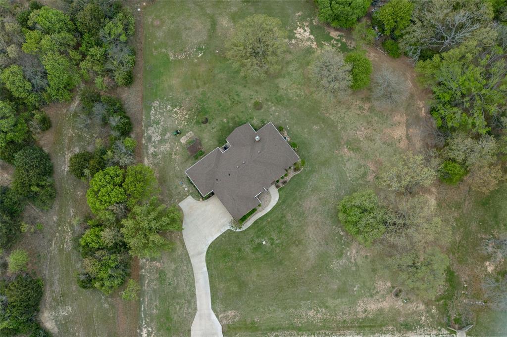 208 Ellis Creek Drive Weatherford, TX 76085 - Photo 2 of 40 an aerial view of a house with a yard