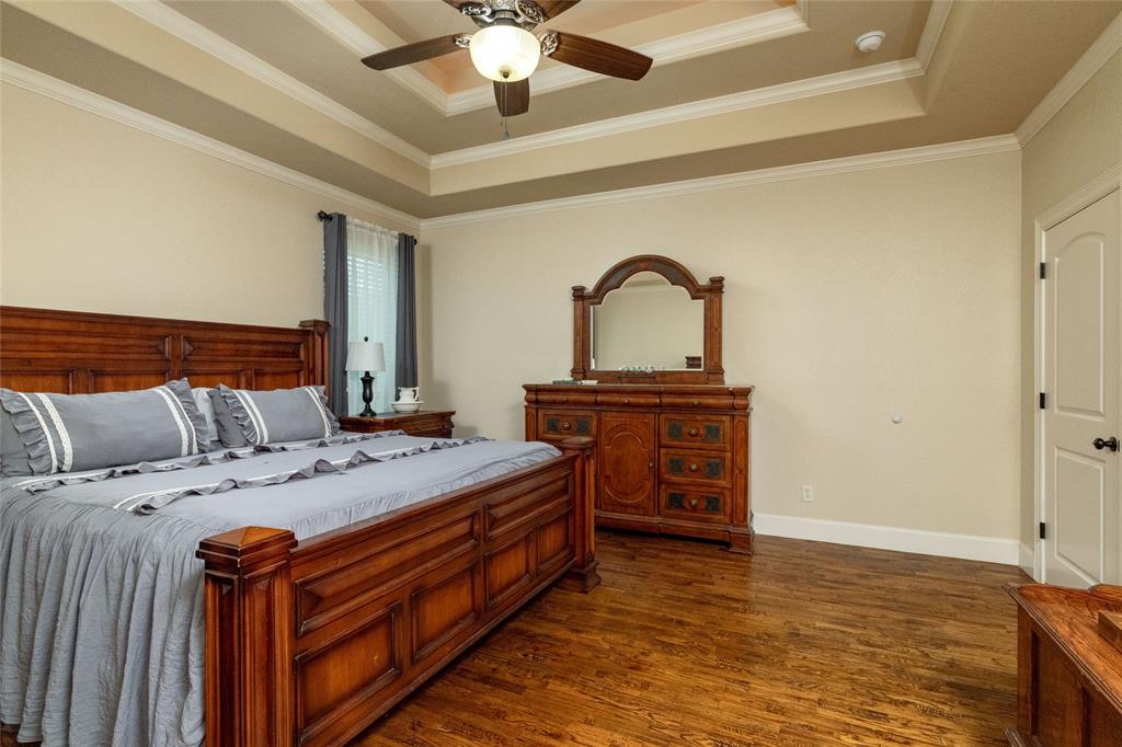 208 Ellis Creek Drive Weatherford, TX 76085 - Photo 24 of 40 a bed room with a bed and a television