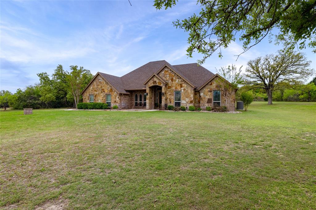 208 Ellis Creek Drive Weatherford, TX 76085 - Photo 3 of 40 a view of a house with a big yard